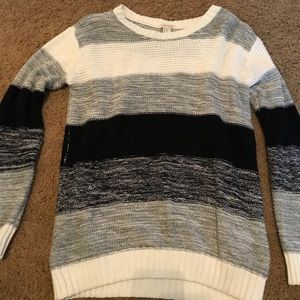 Black, white, gray sweater.
